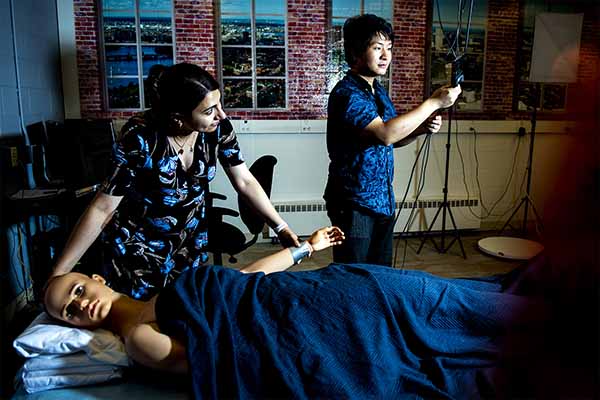 professor and student monitoring sleep behavior